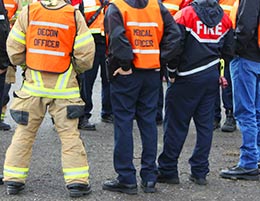 A group of emergency responders meeting in a huddle